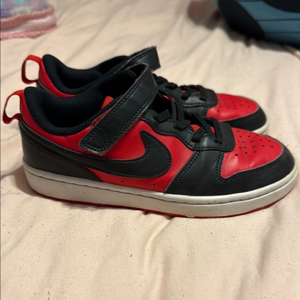 Nike Black and Red Sneakers with Classic Design